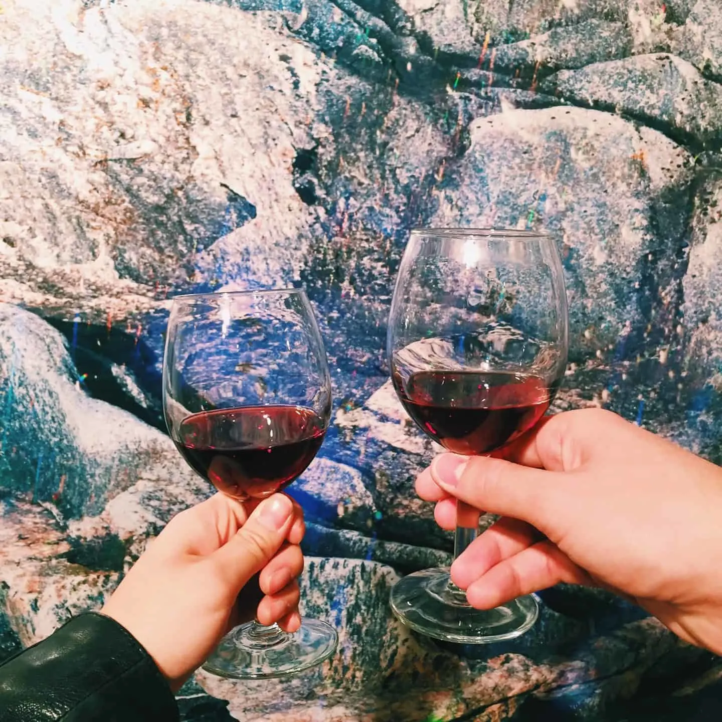 Red wine glasses at an art gallery