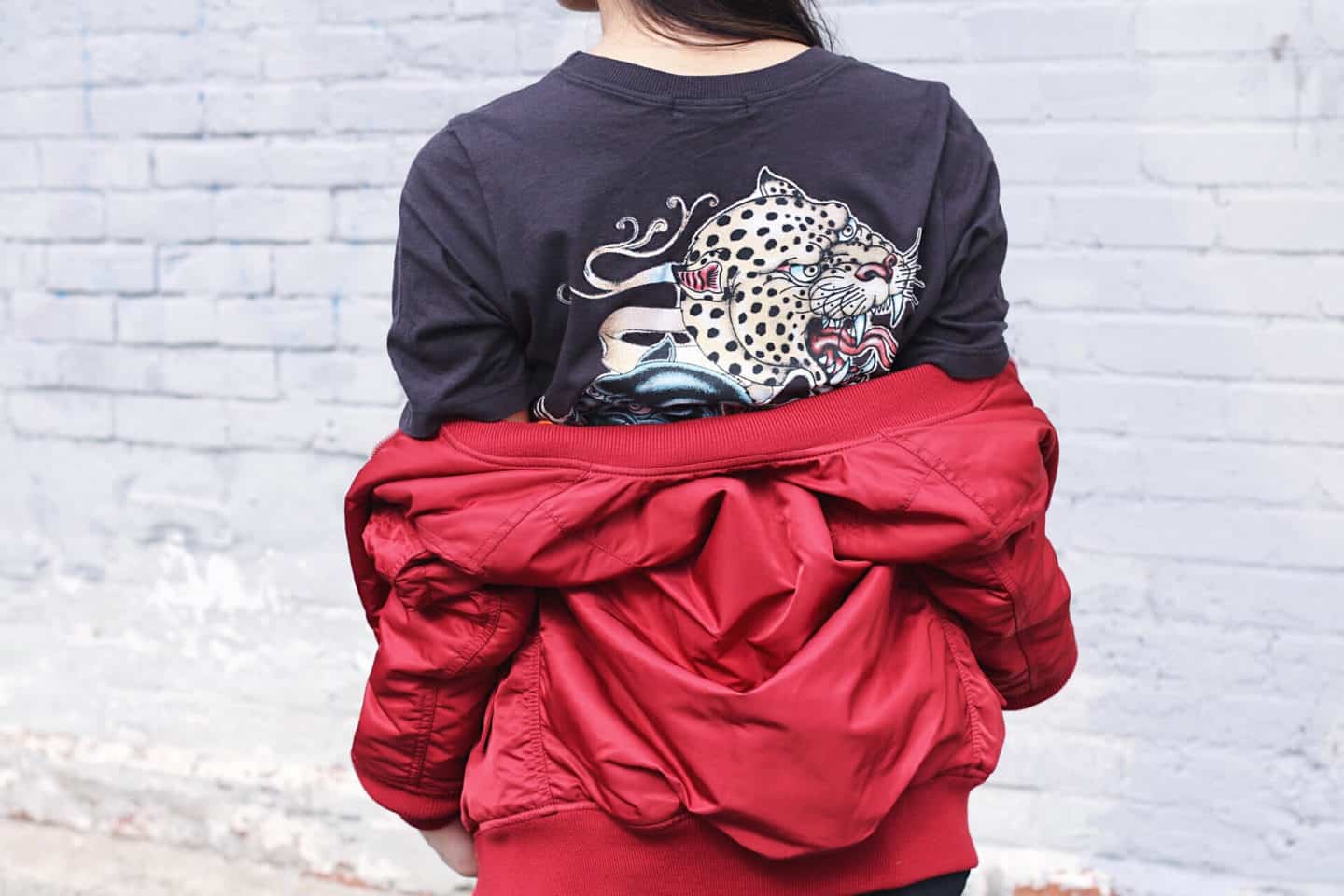 Urban Outfitters choker graphic tee with Alpha Industries red bomber jacket