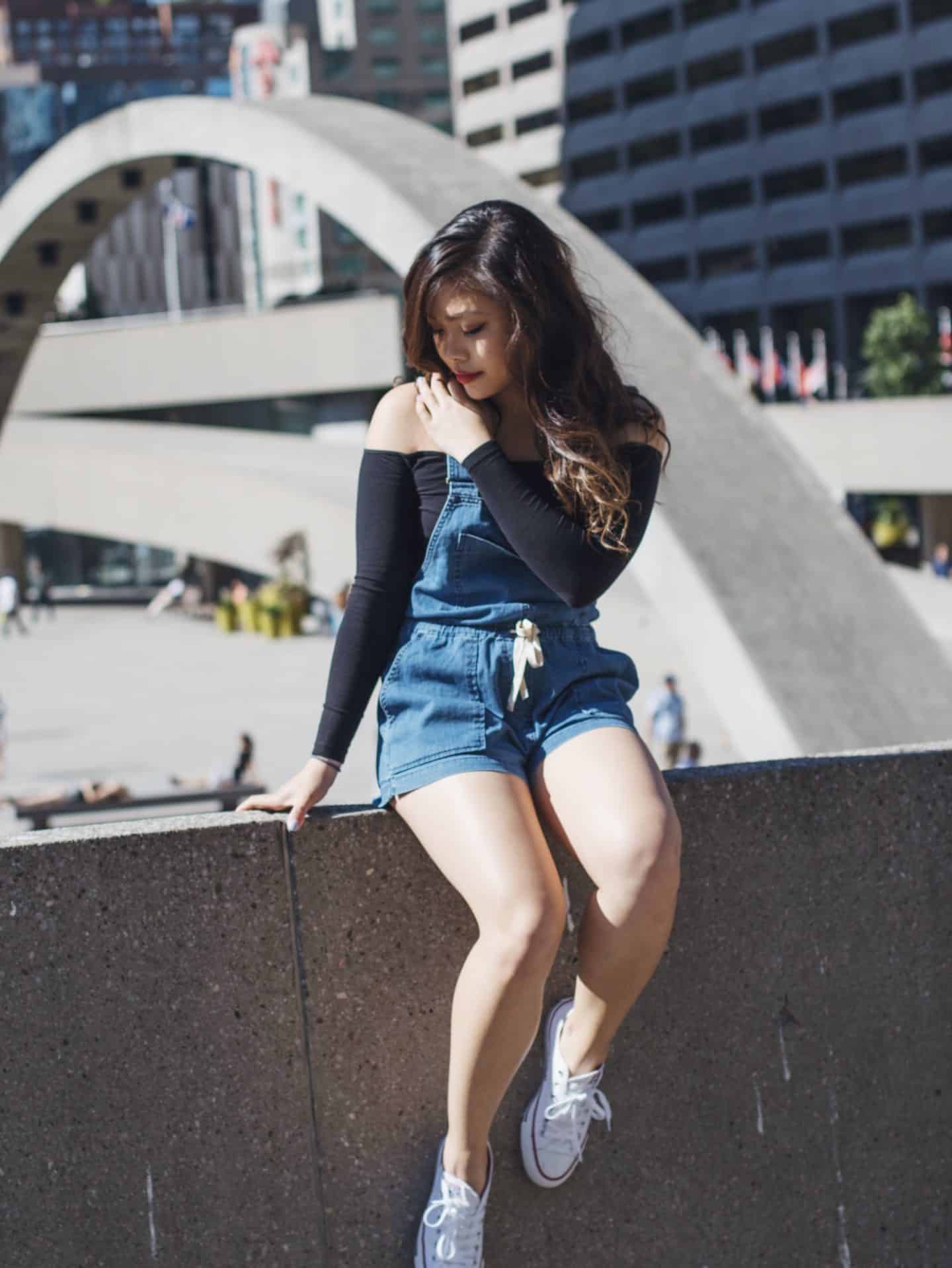 Canada Day outfit featuring denim romper and off shoulder black top