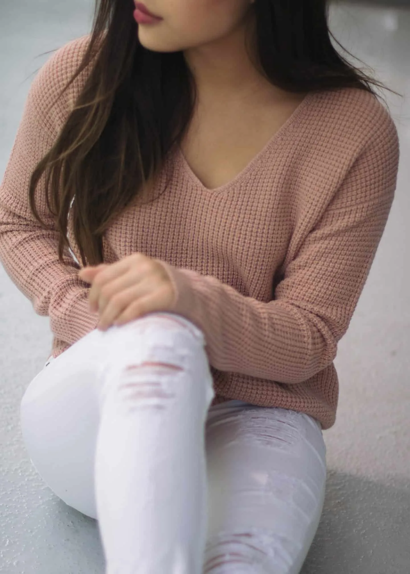 Summer to fall transitional outfit featuring Aritzia pink knit sweater and Guess white distressed jeans