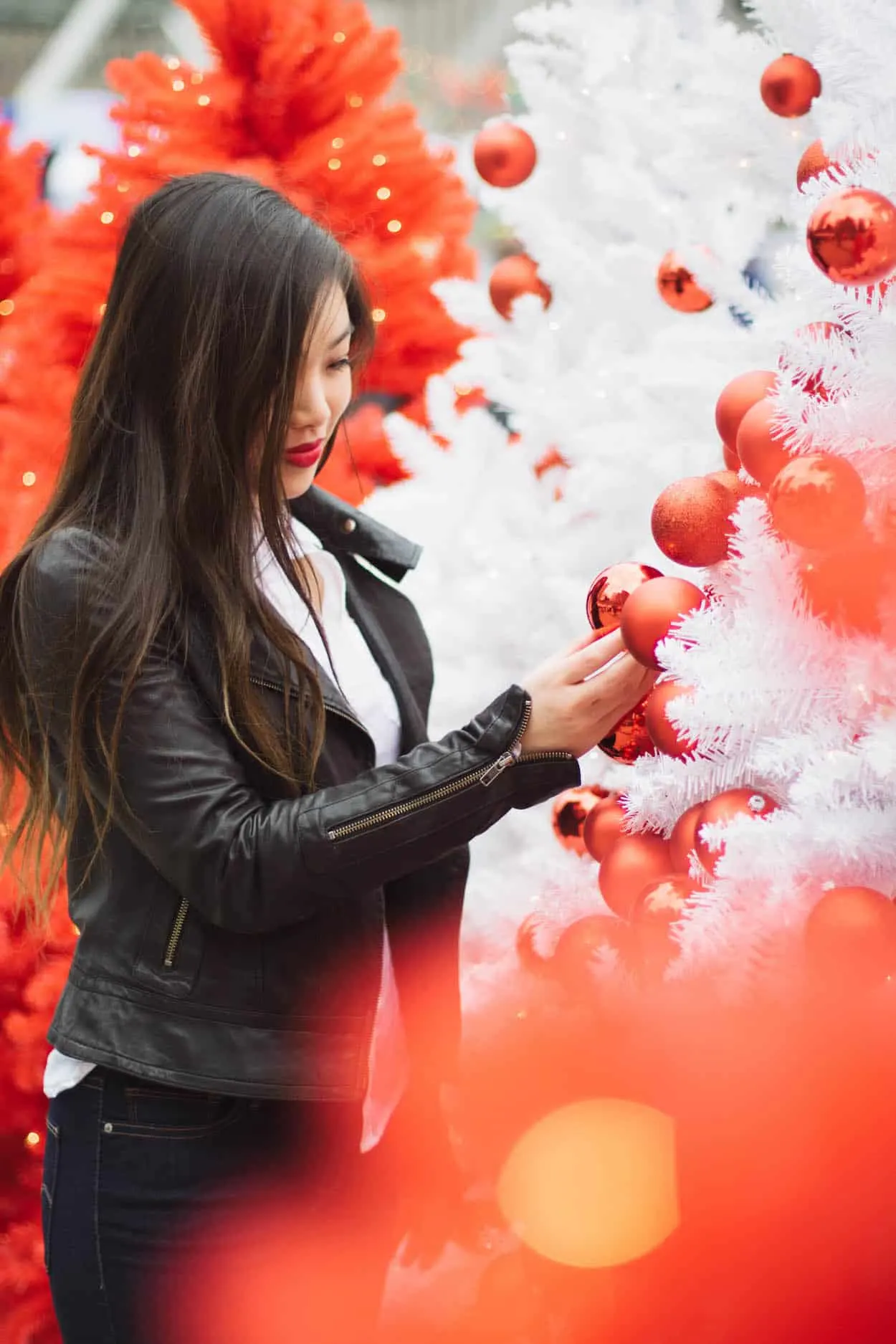 Winter outfit idea featuring a white button down, black leather jacket, and Levi's dark wash denim