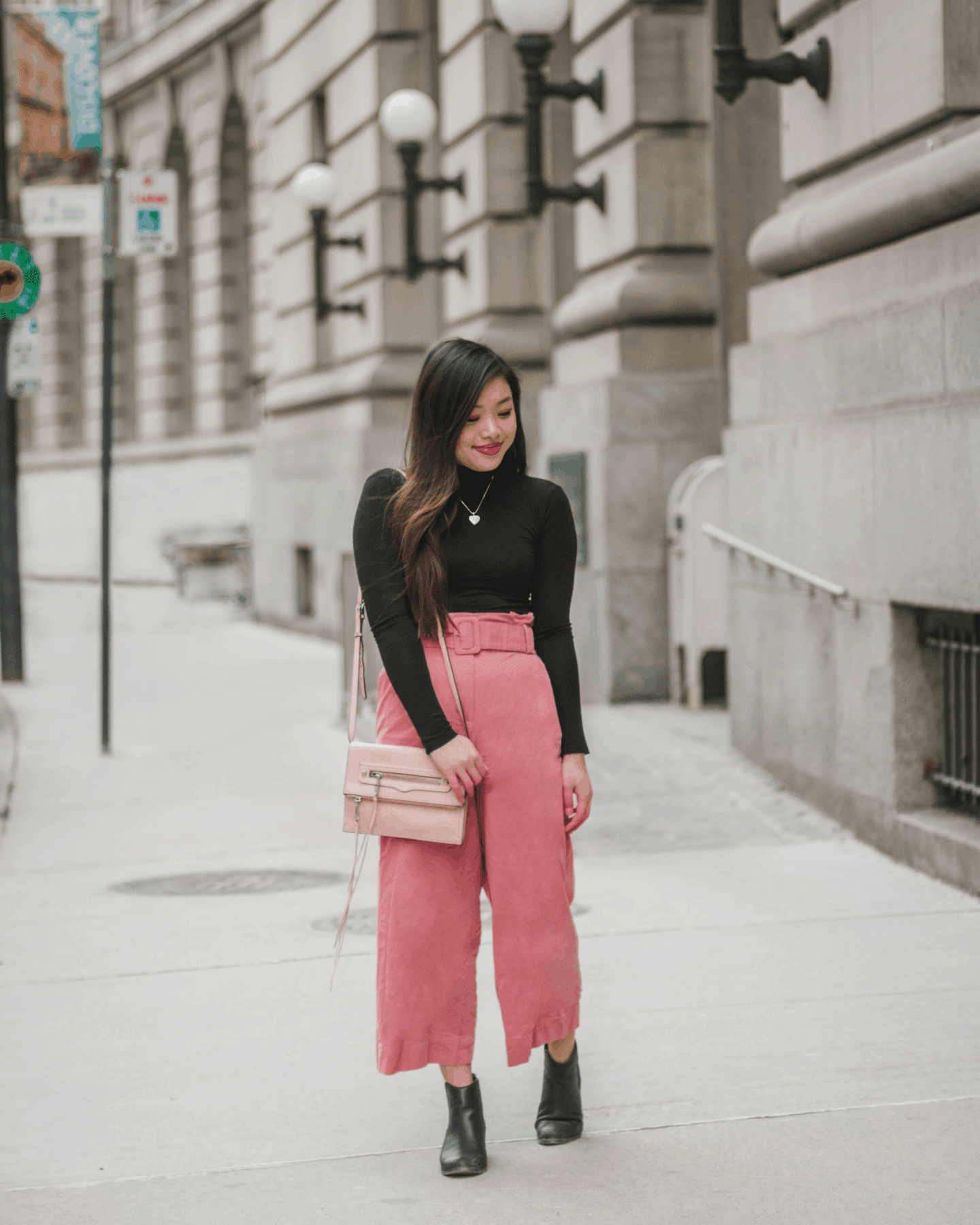 Valentine's Day outfit idea featuring black turtleneck and pink wide leg pants