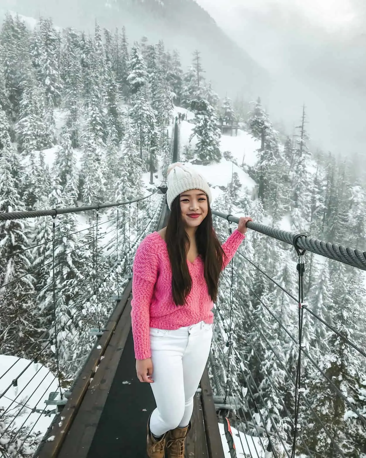 A snowy winter view from the top of the Sea to Sky Gondola in Squamish, British Columbia