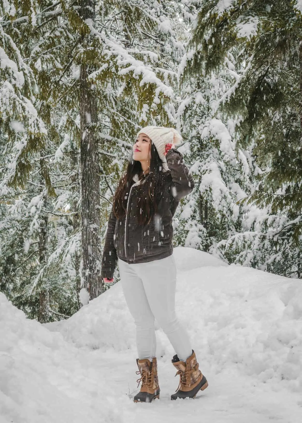 A snowy winter view from the top of the Sea to Sky Gondola in Squamish, British Columbia