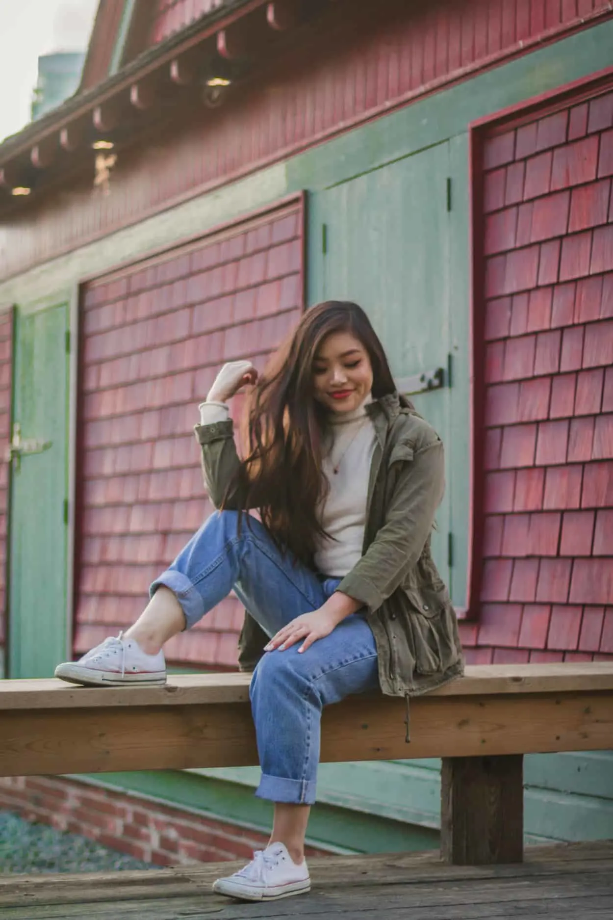 Fall outfit featuring a military inspired jacket, fluffy white turtleneck, vintage Levi's jeans, and white Converse.