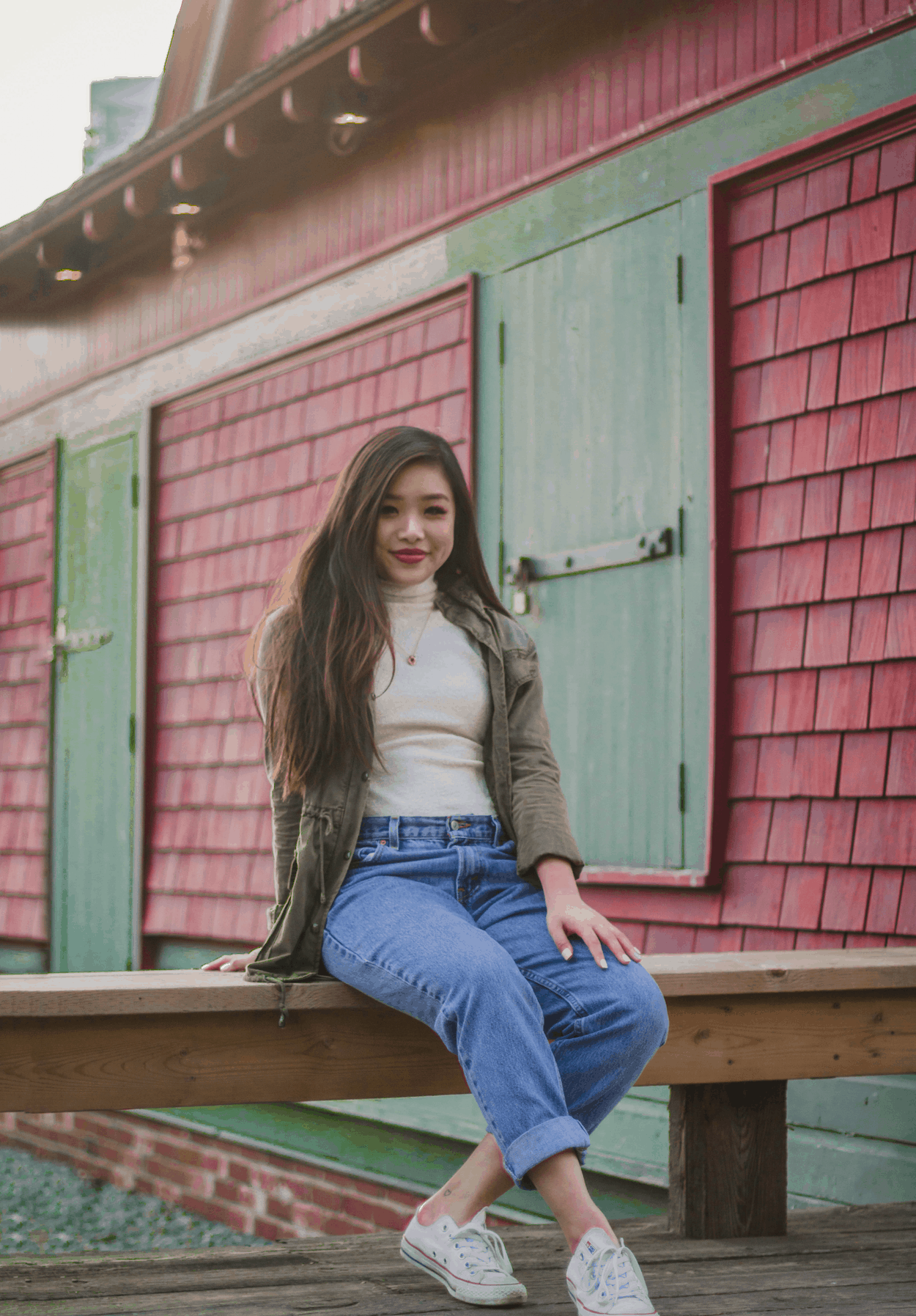 Fall outfit featuring a military inspired jacket, fluffy white turtleneck, vintage Levi's jeans, and white Converse.