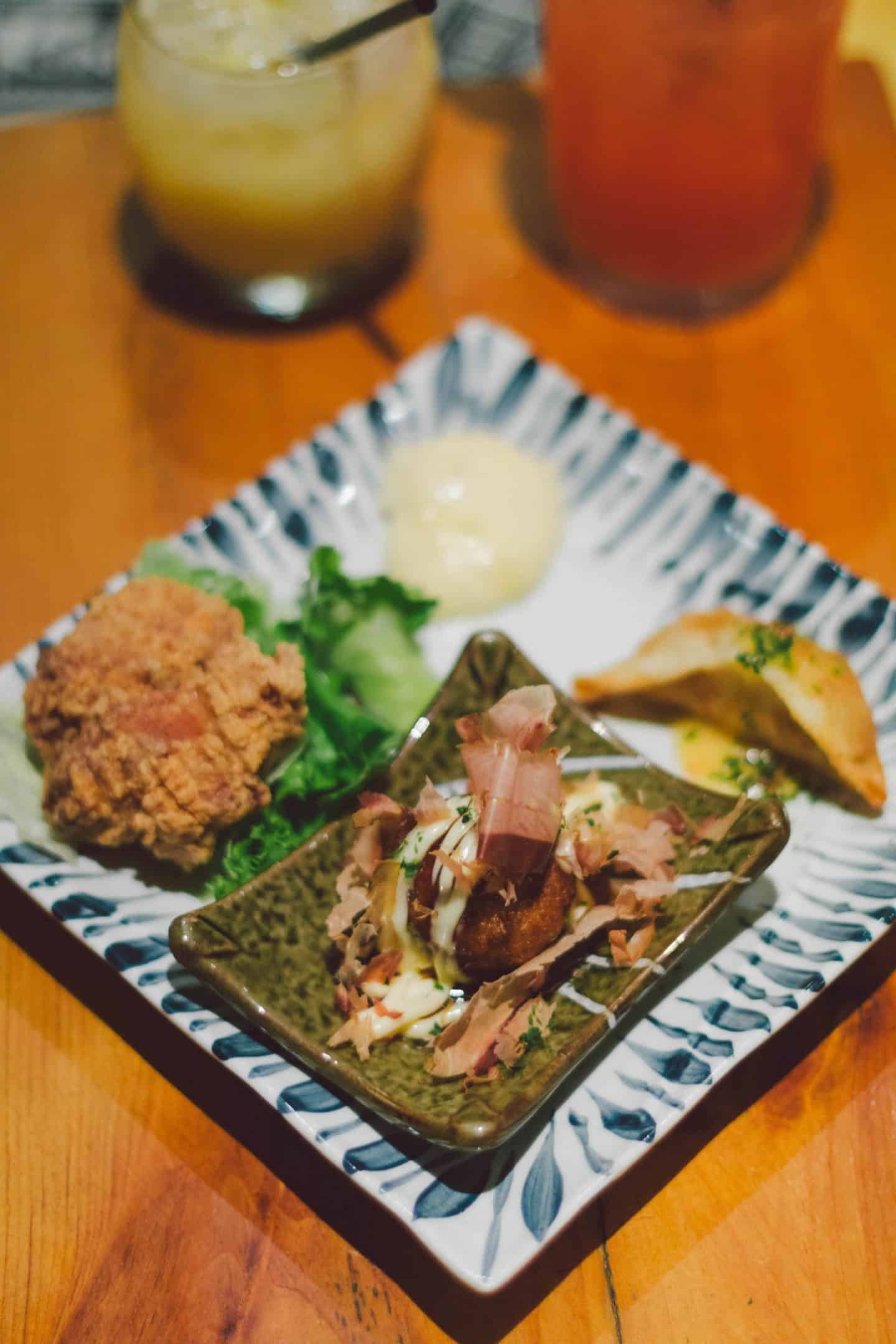 Kinka Izakaya's Fry Platter with chicken karaage, takoyaki, and a vegetable gyoza