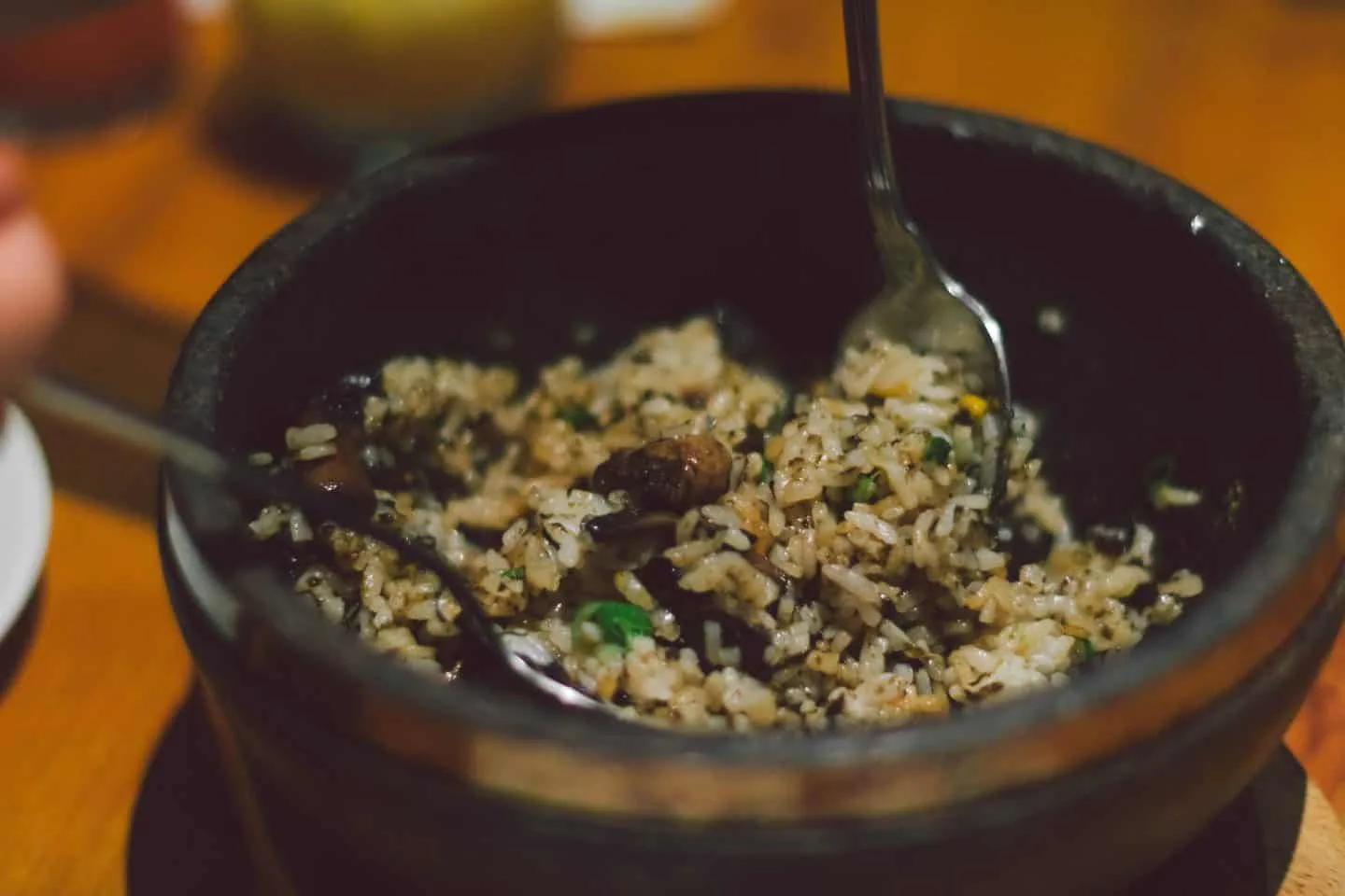 The Kinoko Bibimbap is a vegetarian dish filled with rice, mushrooms, cheese, and seaweed sauce.