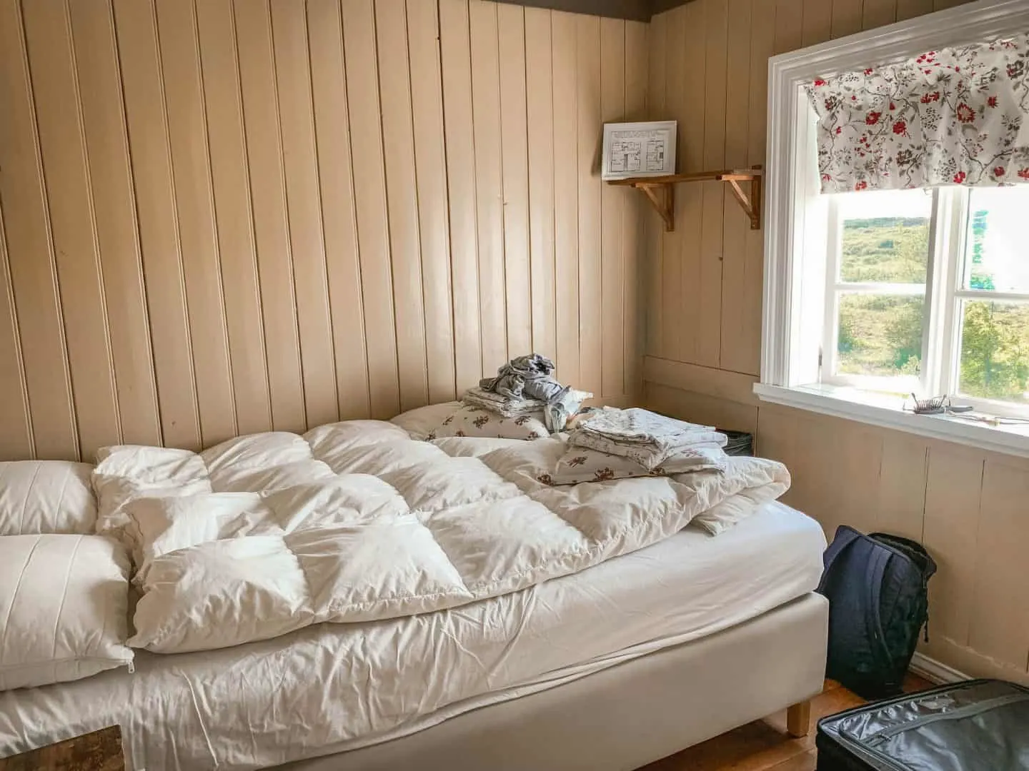 A bedroom inside a farmhouse-inspired cabin on Airbnb