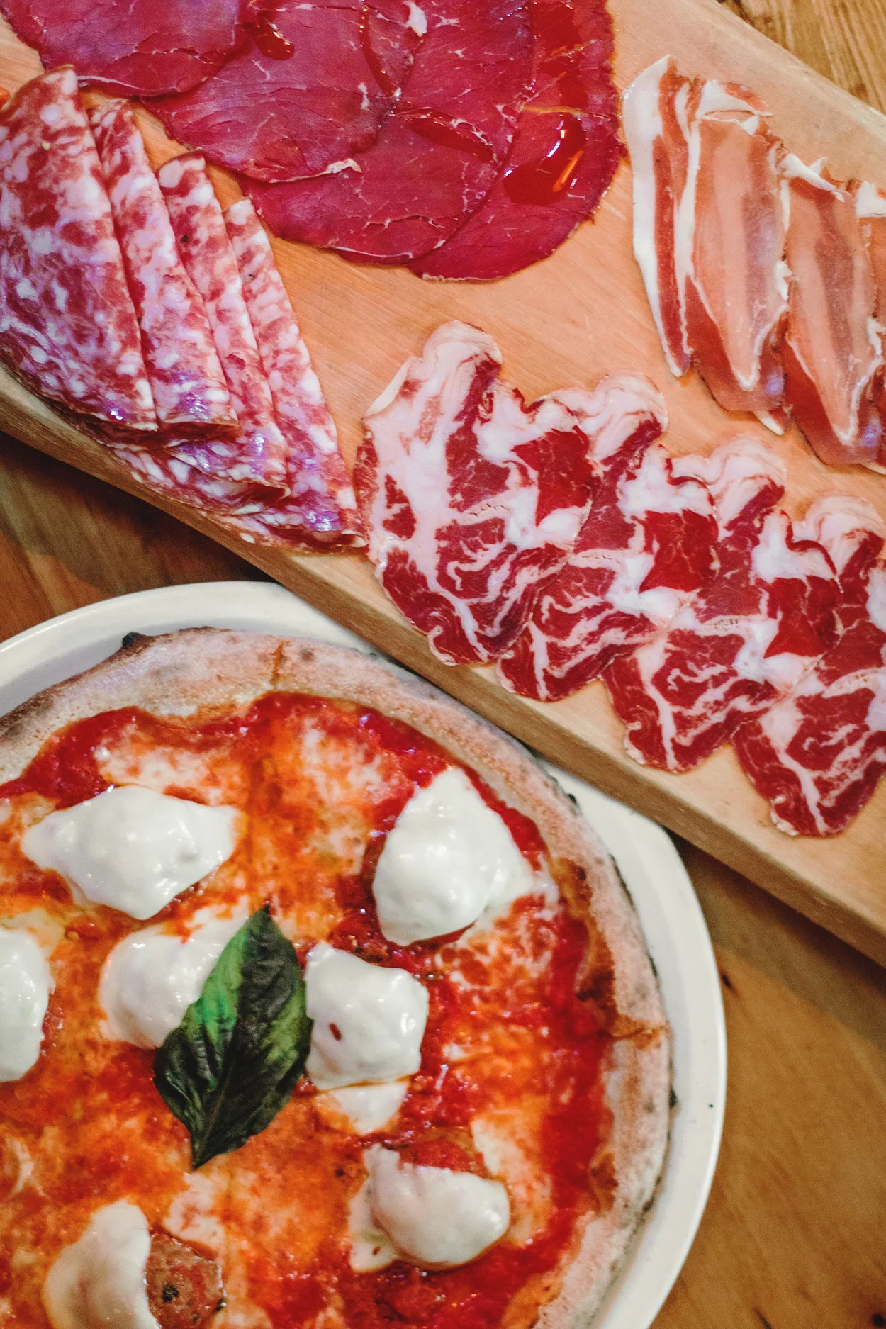 Pizza and cured charcuterie meats from Gusto 101 Italian restaurant in Toronto