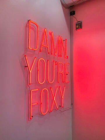 Neon sign at Foxy Box Laser & Wax Bar on Toronto's Queen West